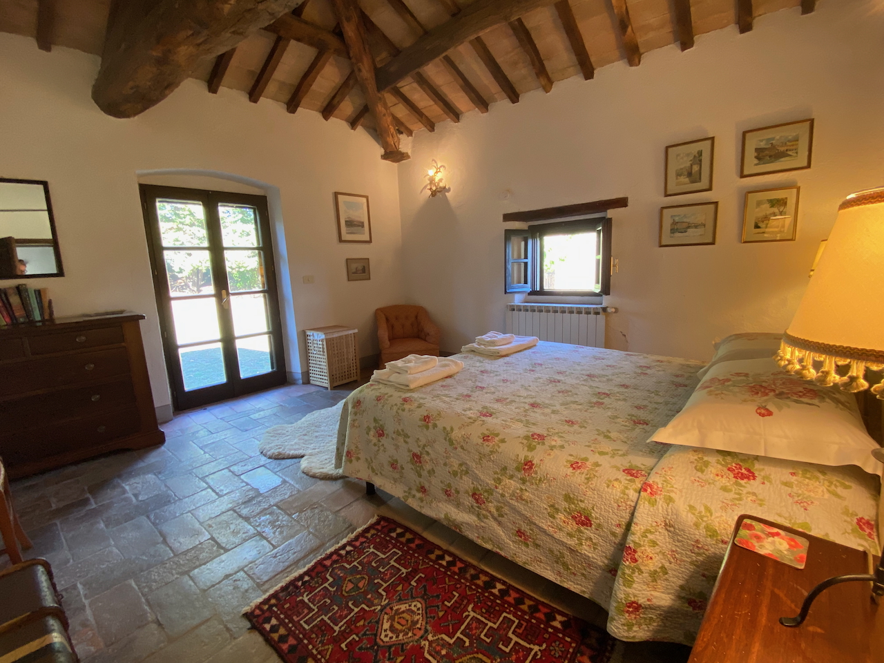 Main House Bedroom with Exposed Beams